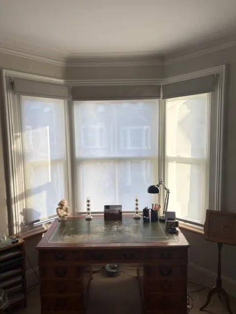 A light-filtering blind in a sunny room